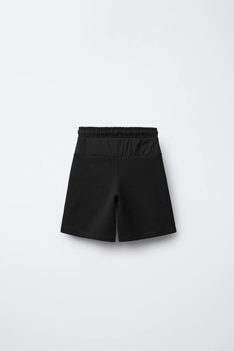 BERMUDA SPORT EN MATIÈRES VARIÉES