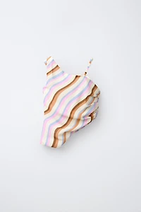 ASYMMETRIC WAVE TOP
