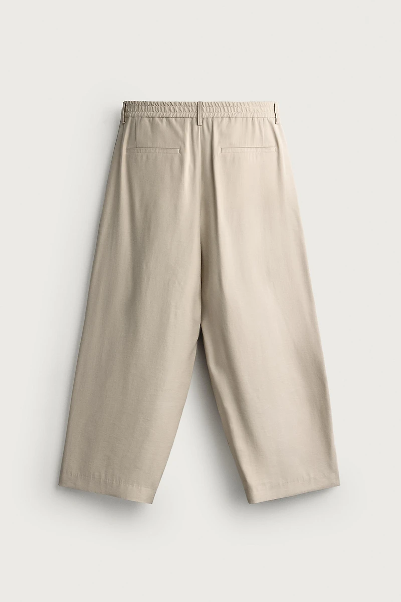 PLEATED RELAXED-FIT PANTS