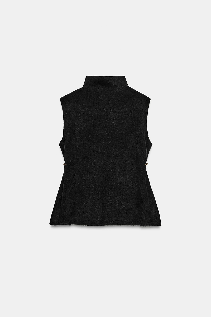 TOP EN MAILLE ASYMÉTRIQUE À DÉCORS LATÉRAUX