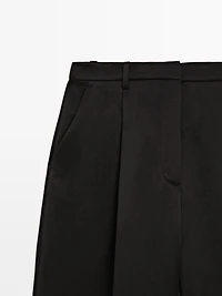 Flowing trousers with pleated details