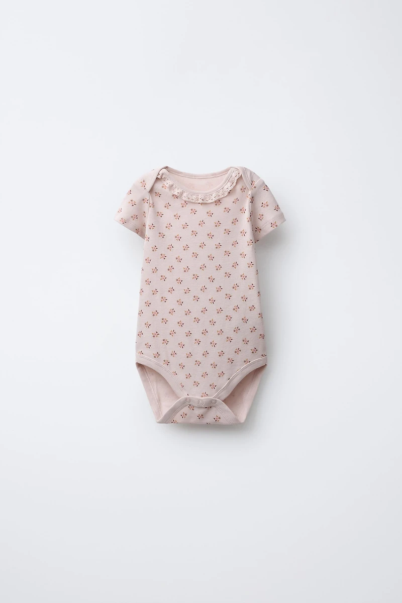 FIVE-PACK OF FLORAL BODYSUITS