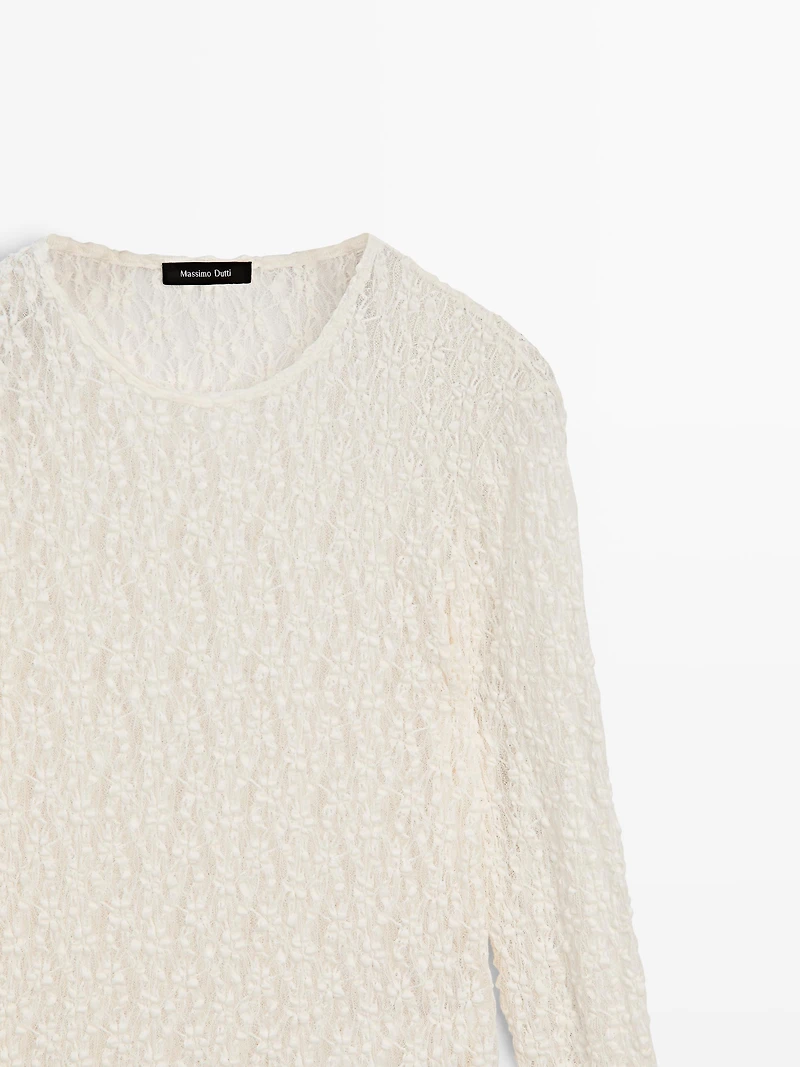 Openwork knit top with long sleeves and lace