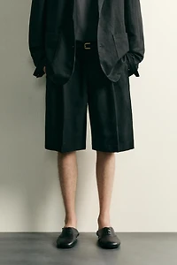 TEXTURED PLEATED SUIT SHORTS