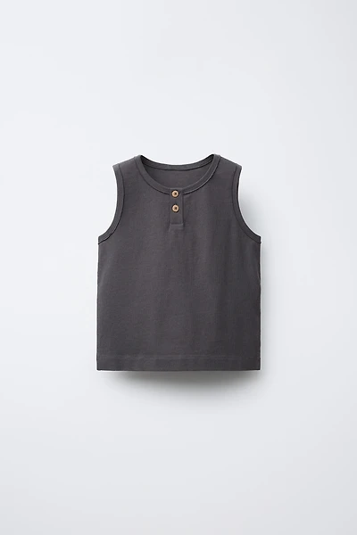 T-SHIRT SANS MANCHES BOUTONS