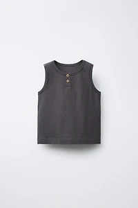 T-SHIRT SANS MANCHES BOUTONS