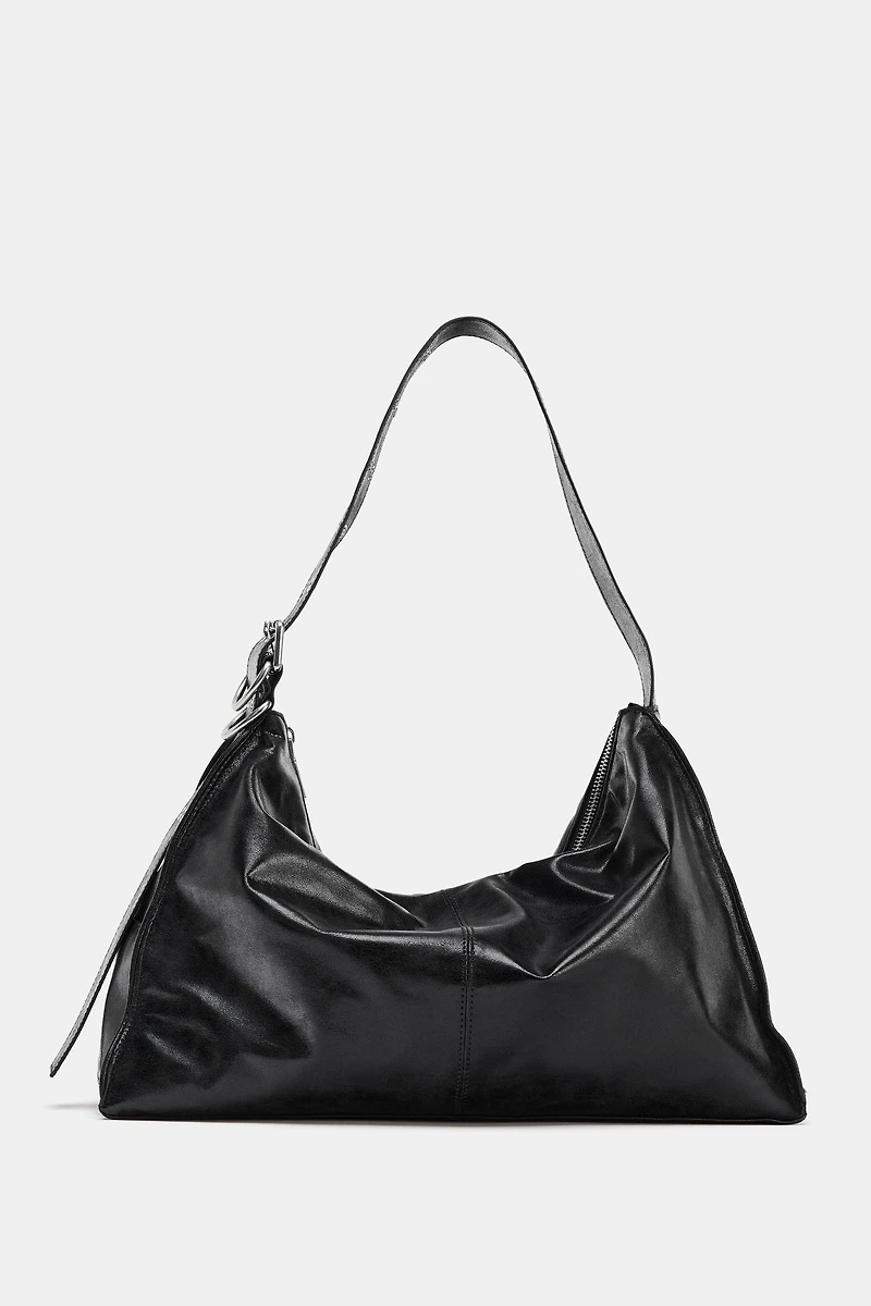 MAXI BUCKET BAG WITH METAL EYELETS