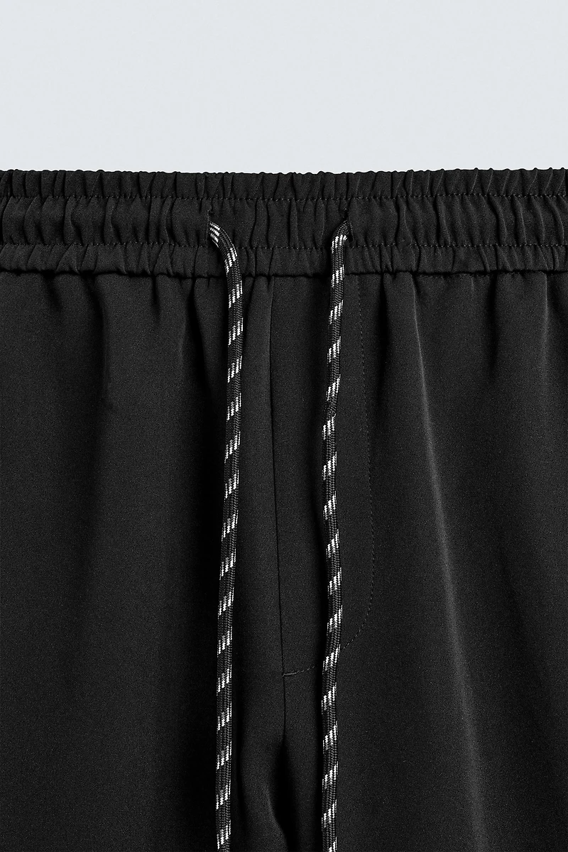 WIDE FIT JOGGER PANTS WITH SIDE STRIPES