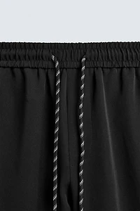 WIDE FIT JOGGER PANTS WITH SIDE STRIPES