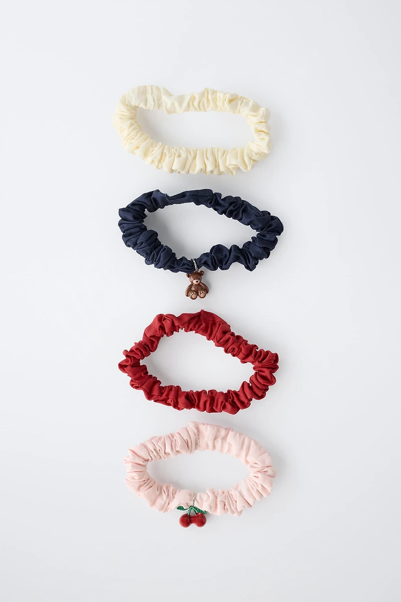 LOT DE QUATRE CHOUCHOUS CHARMS