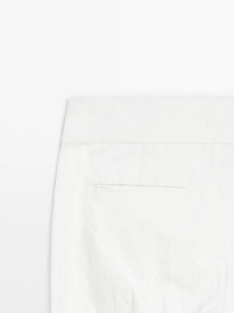 Pantalon slim taille basse avec boucles