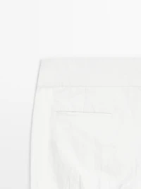 Pantalon slim taille basse avec boucles