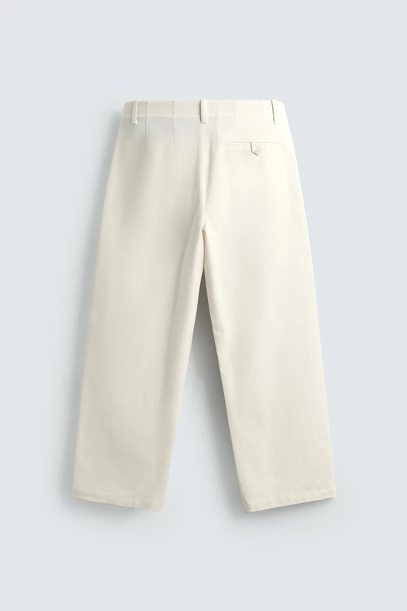PLEATED WIDE FIT CHINO PANTS