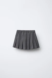 JUPE-SHORT PLIS PLATS LACETS