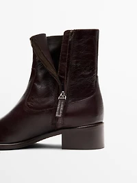 Crackled leather flat ankle boots