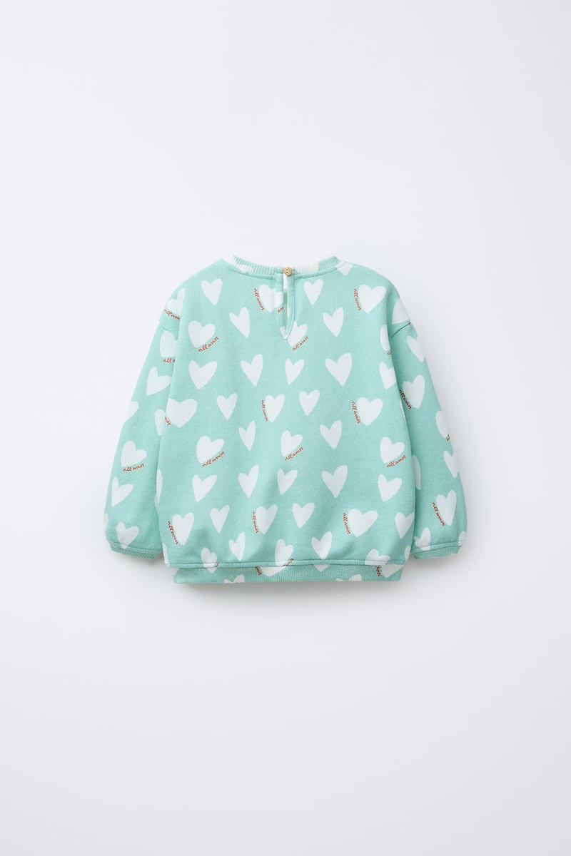 HEART PRINT SWEATSHIRT