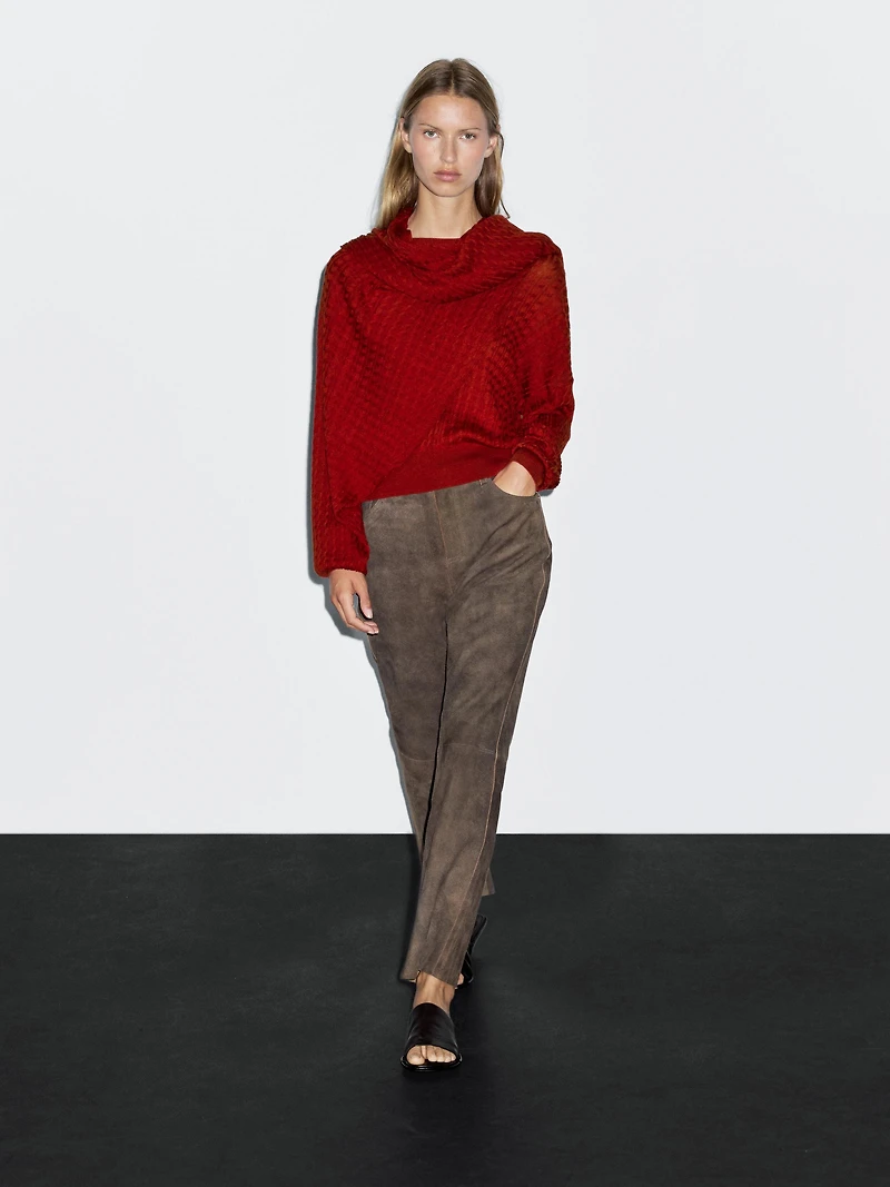 Cable-knit sweater with scarf detail