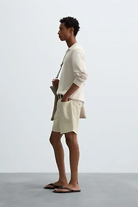 WASHED COTTON BERMUDA SHORTS