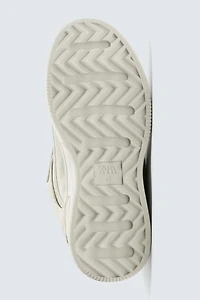 DISTRESSED THICK-SOLED SNEAKERS