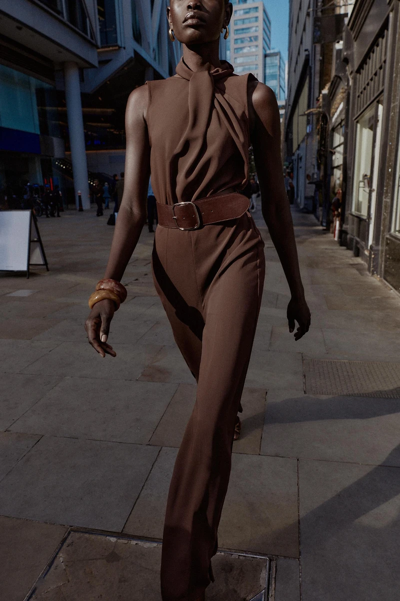 SLEEVELESS BELTED JUMPSUIT