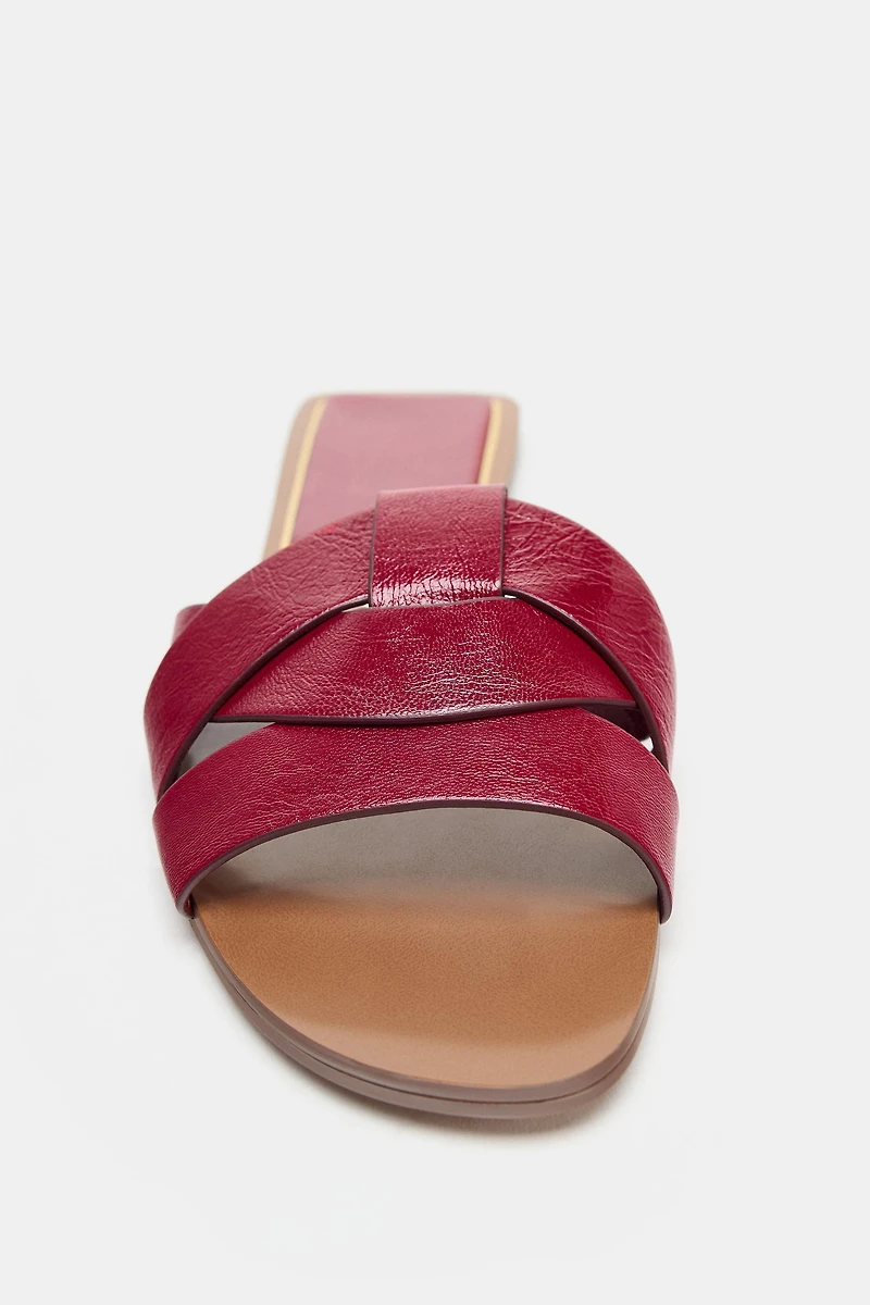 FLAT CROSSED LEATHER SANDALS