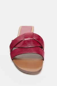 FLAT CROSSED LEATHER SANDALS