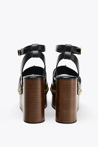 STUDDED LEATHER WEDGE SANDALS