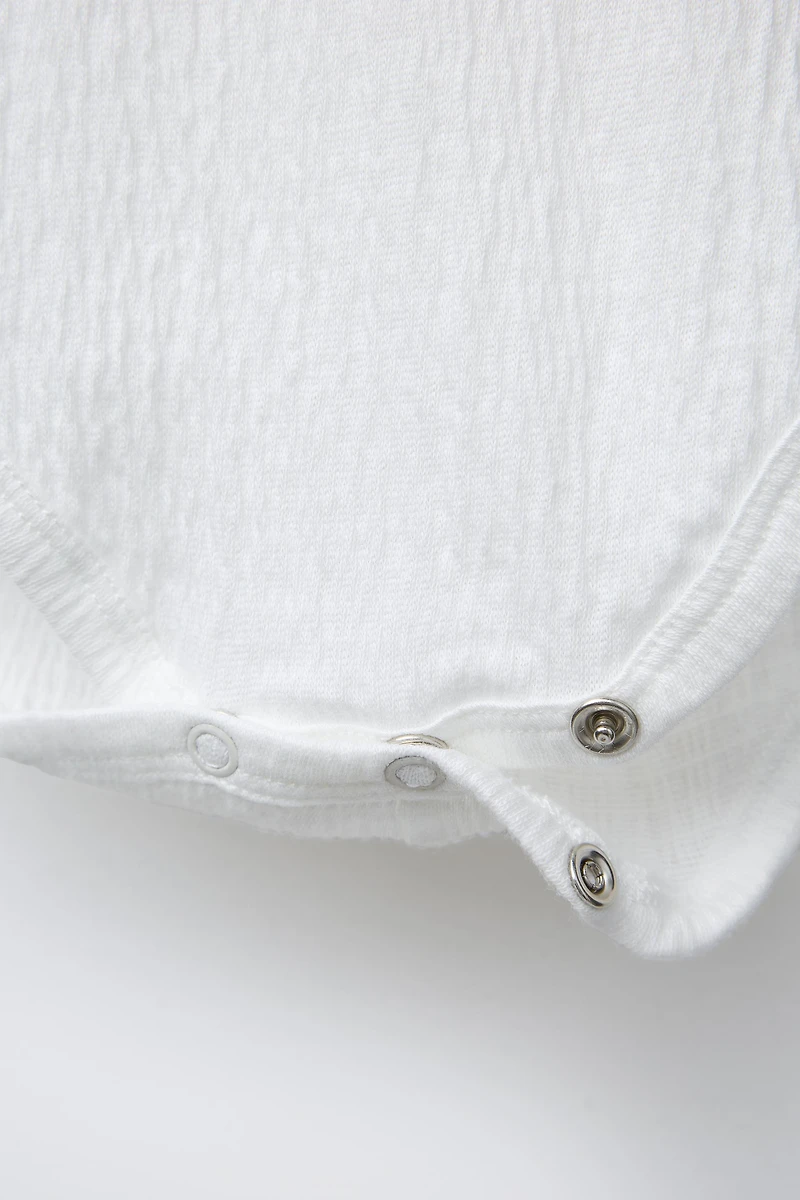 TEXTURED BODYSUIT