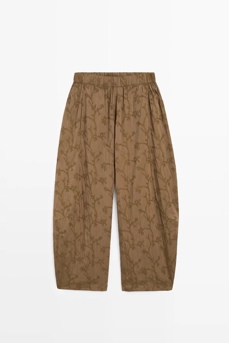 Trousers with embroidered detail and elastic waistband