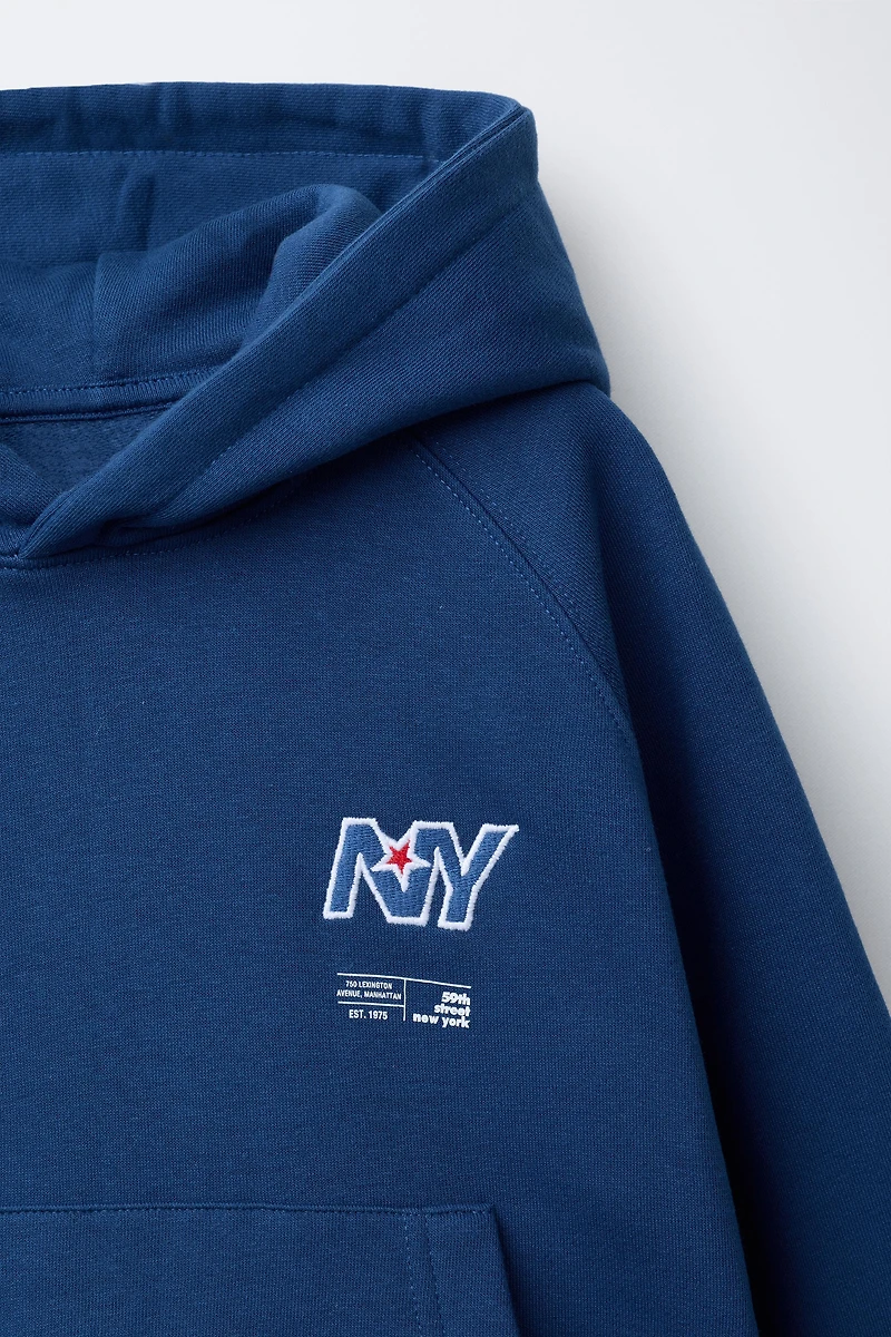 EMBROIDERED POCKET SWEATSHIRT