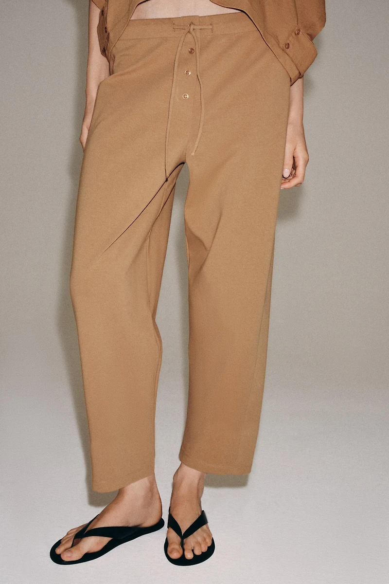 INTERLOCK TAPERED PANTS