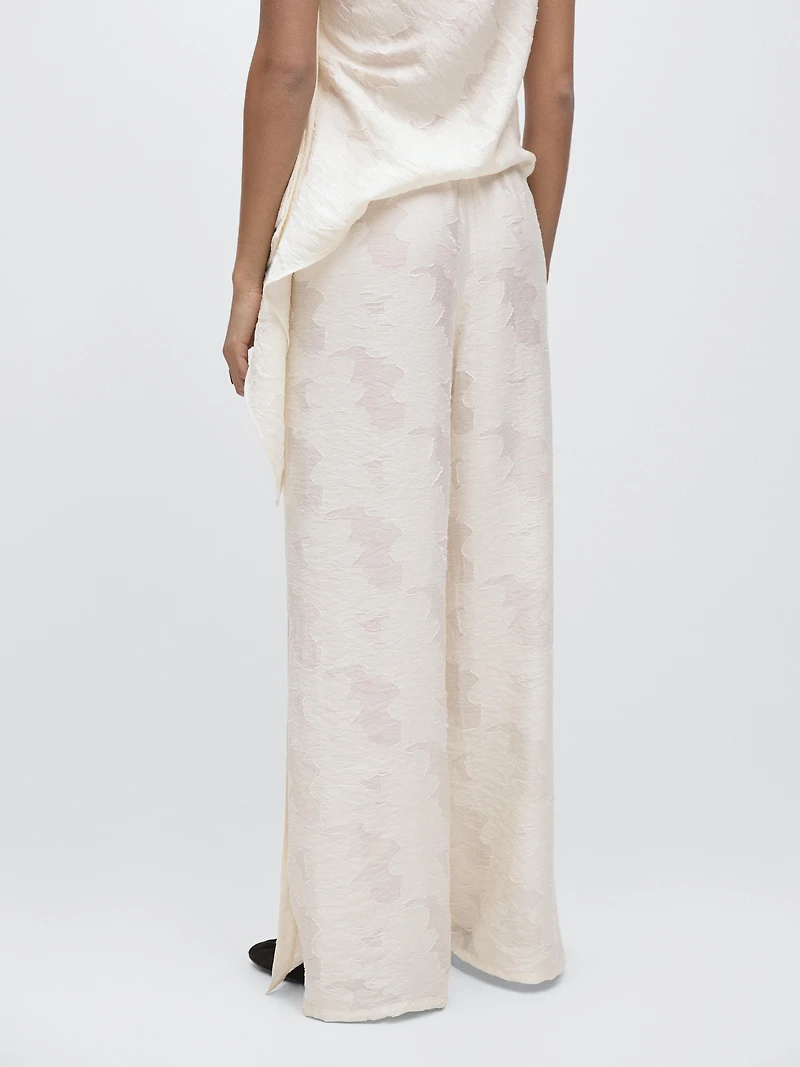 Pantalon élastique fluide détail tissu