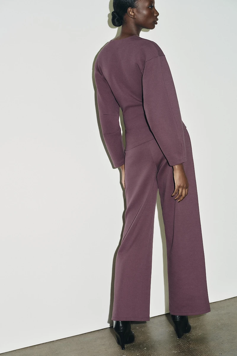 INTERLOCK JUMPER WITH DARTS