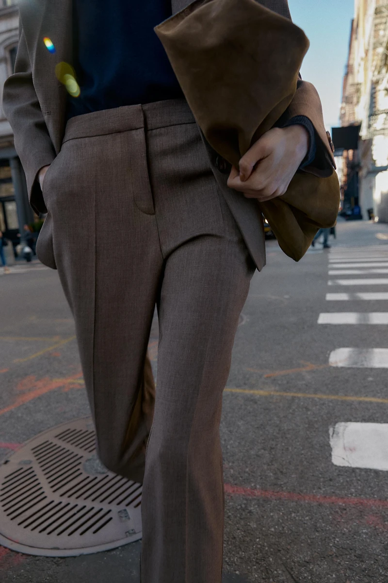 PANTS WITH BUTTONED HEM