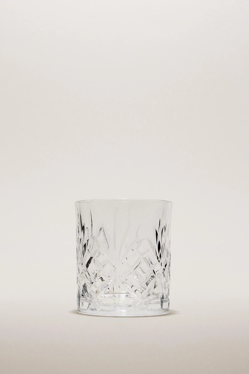 CRYSTALLINE TUMBLER WITH RAISED DESIGN