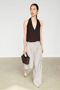 Pantalon en laine mélangée à pinces et boutons