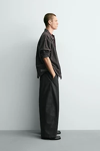 RELAXED FIT PANTS WITH TWISTED SEAM