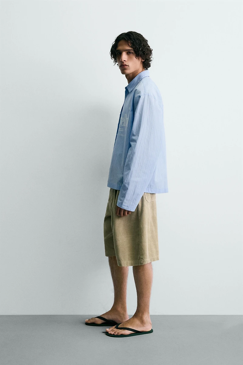 RELAXED FIT PLAID TEXT SHIRT