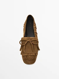 Split suede loafers with fringing