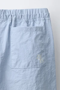 NYLON PANTS WITH BOWS