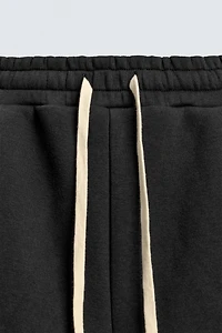 TECHNICAL PLEATED JOGGER PANTS