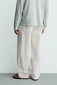PLEATED BARREL FIT DENIM CHINO PANTS