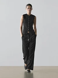 Veste sans manches col V avec boutons