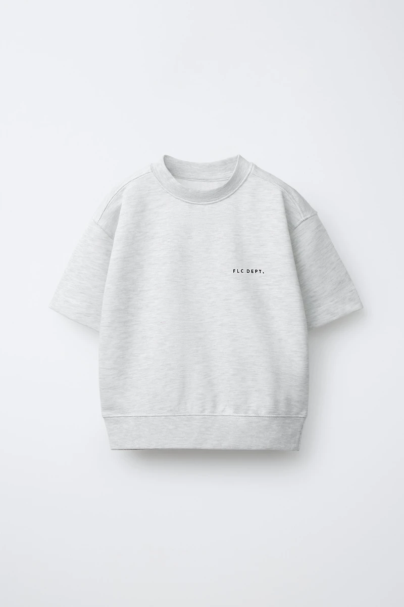 SWEAT MANCHES COURTES INSCRIPTION EN RELIEF
