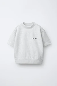 SWEAT MANCHES COURTES INSCRIPTION EN RELIEF