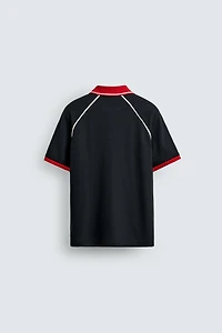 POLO STRUCTURÉ À LISERÉS CONTRASTANTS