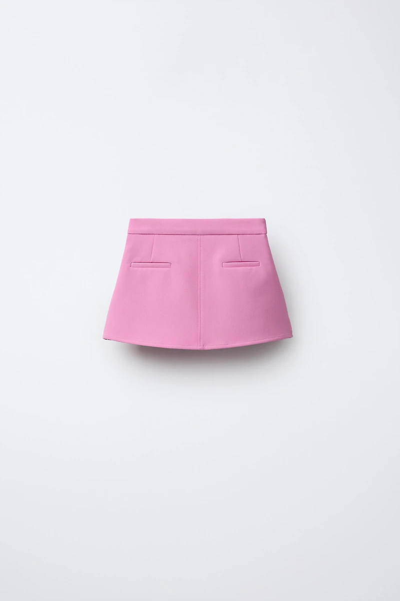 JUPE À BOUTON BIJOU