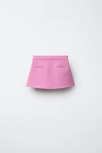 JUPE À BOUTON BIJOU