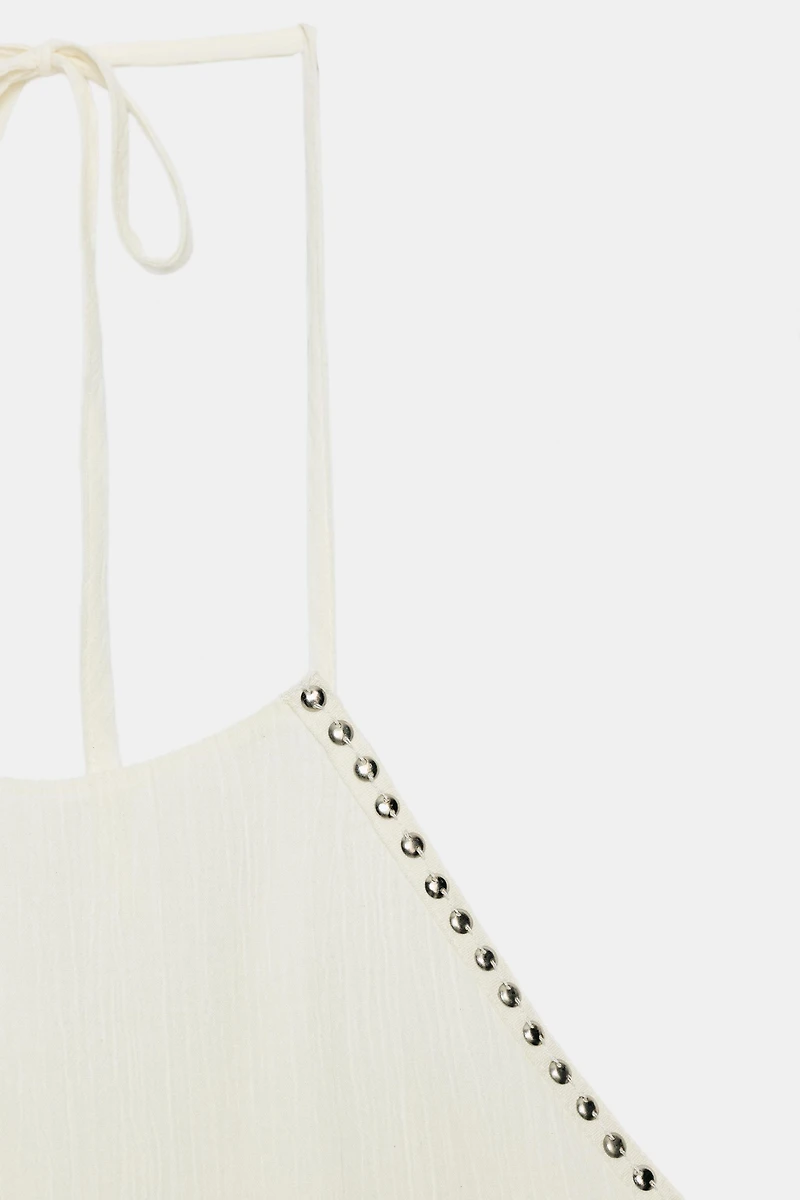 STUDDED RUFFLE HALTER TOP