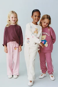 PANTALON JOGGER BANDE LATÉRALE NŒUD